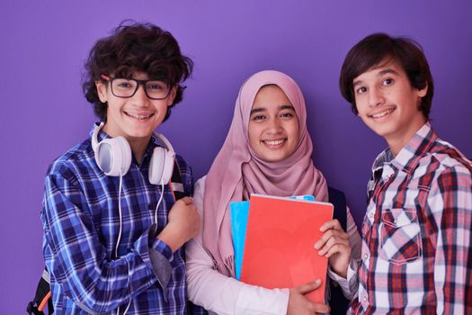 Arabic teenagers group, students team walking forward in future and back to school concept pink background