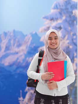 portrait of happy female middle eastern university student or teenager wearing casual islamic religious  look for school