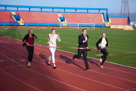 business people running together on  athletics racing track
