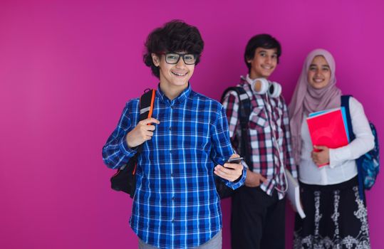 Arabic teenagers group, students team walking forward in future and back to school concept pink background