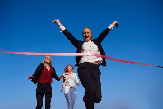 business people running together on  athletics racing track