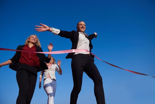 business people running together on  athletics racing track