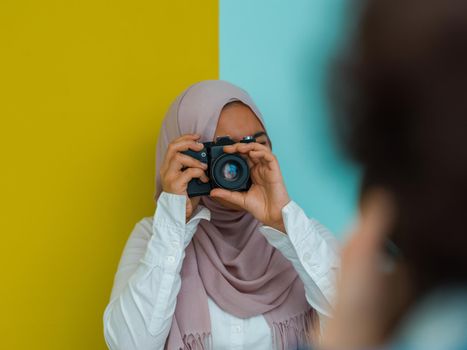 a photo of a young Arab teenager having fun with a camera. Selective focus. High quality photo