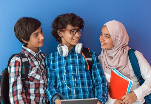 Modern Arab teens use smartphones, tablets, and laptops to study during online classes due to corona virus pandemic. High quality photo