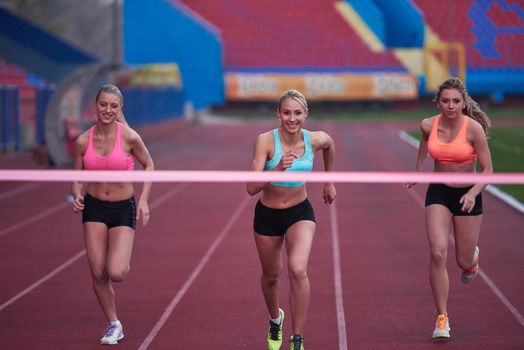 Female Runners Finishing athletic  Race Together