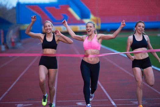 Female Runners Finishing athletic  Race Together