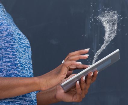 Young Happy African American Woman Using Digital Tablet  Isolated on a gray background