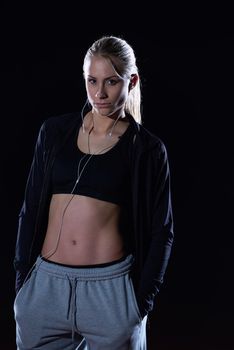 young runner sporty woman relaxing and stretching on athletic race track