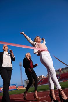 business people running together on racing track