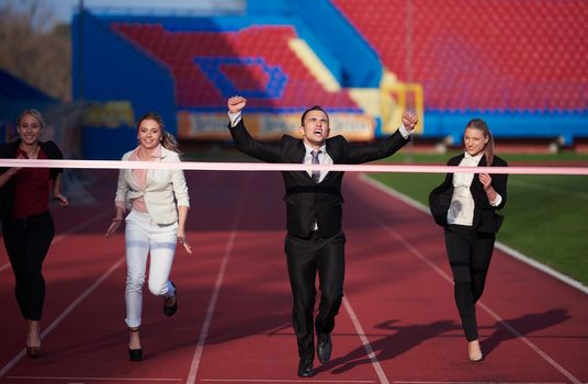 business people running together on racing track