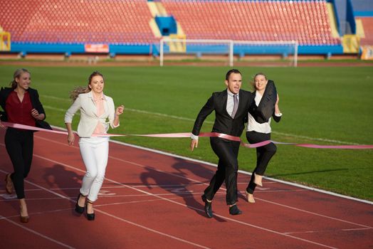 business people running together on racing track