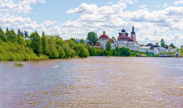 Beautiful view from the Volga river to the ancient Russian monastery. Sunny, fine day, blue sky and cumulus clouds. Concept history of Russia, tourism.