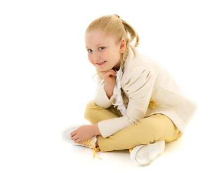 A nice little girl thinks. The concept of education and school, children's creativity. Isolated on white background.