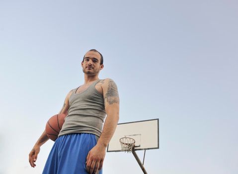 basketball player practicing and posing for basketball and sports athlete concept