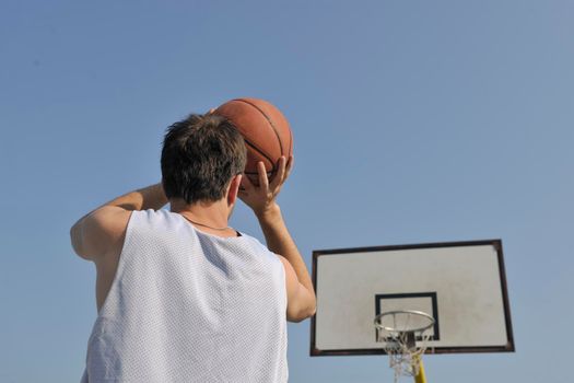 basketball player practicing and posing for basketball and sports athlete concept