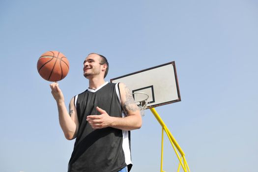 basketball player practicing and posing for basketball and sports athlete concept