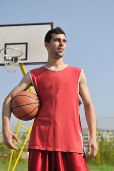 basketball player practicing and posing for basketball and sports athlete concept