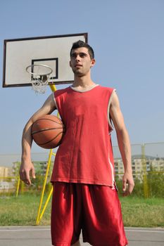 basketball player practicing and posing for basketball and sports athlete concept