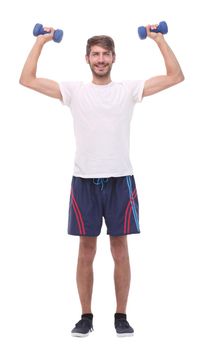 in full growth.young man with dumbbells.isolated on white background