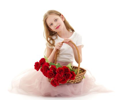 Charming little girl with a basket of flowers. Concept of holiday, summer mood. Isolated on white background.