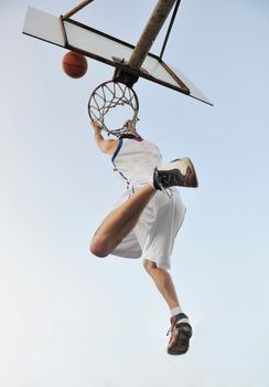 basketball player practicing and posing for basketball and sports athlete concept