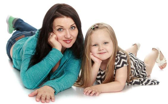 Mother and little daughter lying on the floor with his head in his hands - Isolated on white background