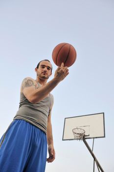 basketball player practicing and posing for basketball and sports athlete concept