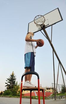 basketball player practicing and posing for basketball and sports athlete concept