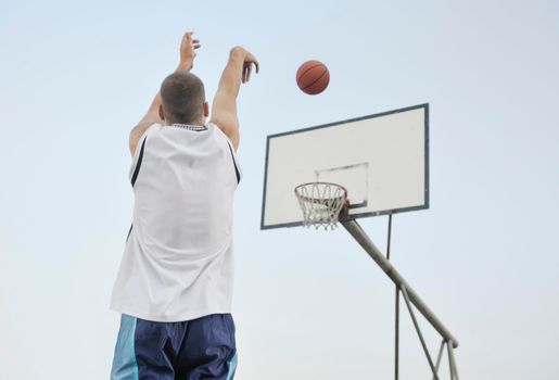 basketball player practicing and posing for basketball and sports athlete concept