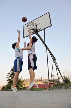 woman basketball player have treining and exercise at basketball court at city on street