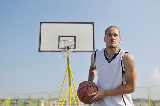 basketball player practicing and posing for basketball and sports athlete concept