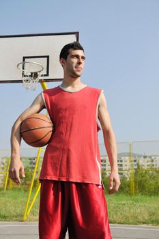 basketball player practicing and posing for basketball and sports athlete concept