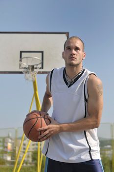 basketball player practicing and posing for basketball and sports athlete concept