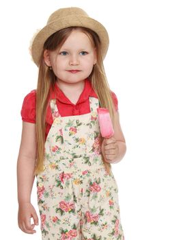 Portrait of cute little girl with long flowing blond hair to her waist. In a hat and shorts , the girl is holding a Popsicle. Close-up - Isolated on white background