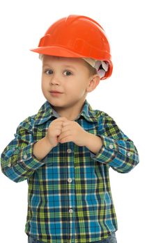 Cute little boy in a helmet of the Builder. Close-up - Isolated on white background