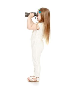 Cute little girl with long blond hair below the shoulders , in a white jumpsuit , keep the angle big binoculars . the little girl turned sideways to the camera and looks away