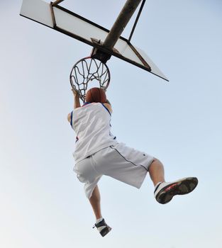 basketball player practicing and posing for basketball and sports athlete concept