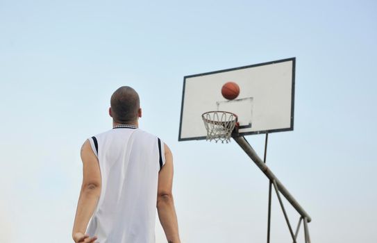 basketball player practicing and posing for basketball and sports athlete concept