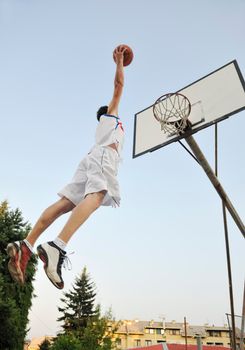 basketball player practicing and posing for basketball and sports athlete concept