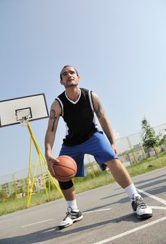 basketball player practicing and posing for basketball and sports athlete concept