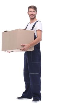 in full growth. a man in a jumpsuit holding a large box.isolated on white background