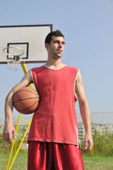 basketball player practicing and posing for basketball and sports athlete concept