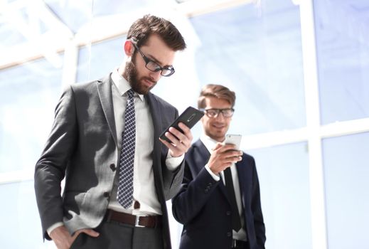 two business people with smartphones.photo with copy space