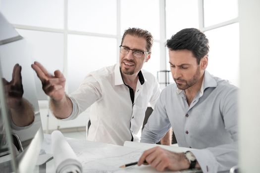 two architects discussing the project in the office.photo with text space