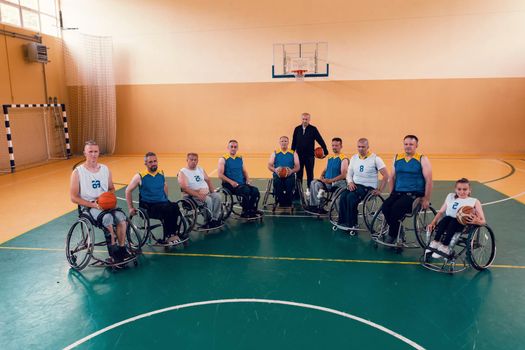 a photo of basketball teams with disabilities with the selector in the big hall before the start of the basketball game. Selective focus 