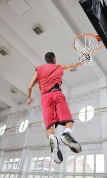 young and healthy people man have recreation and training exercise  while play basketball game at sport gym indoor hall