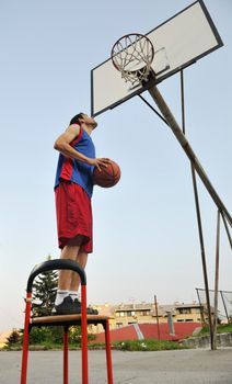 basketball player practicing and posing for basketball and sports athlete concept