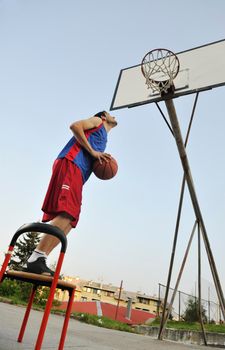 basketball player practicing and posing for basketball and sports athlete concept