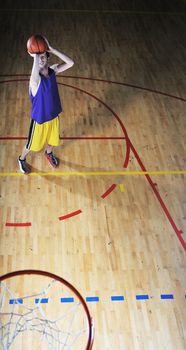 one healthy young  man play basketball game in school gym indoor