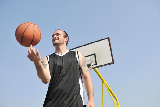 basketball player practicing and posing for basketball and sports athlete concept